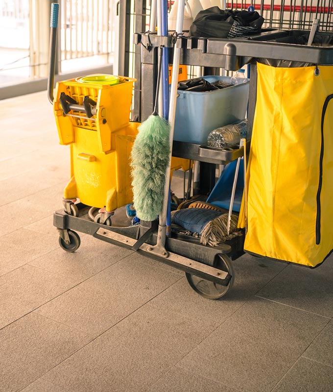 about-us-lolas-shiny-solutions-visalia Janitorial cleaning cart with mop bucket, duster, and supplies on tile floor