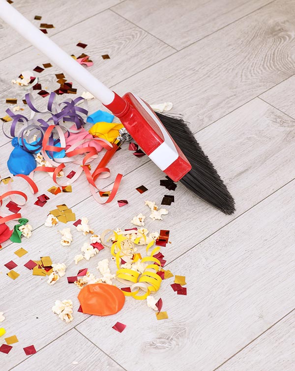 special_event-cleaning-lolas-shiny-solutions Broom cleaning up party confetti and debris, event cleaning service